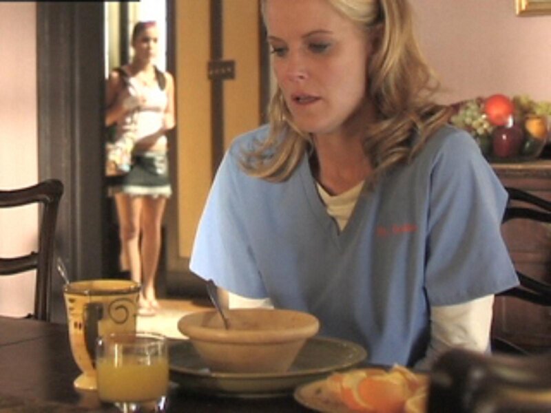 woman eating breakfast at table