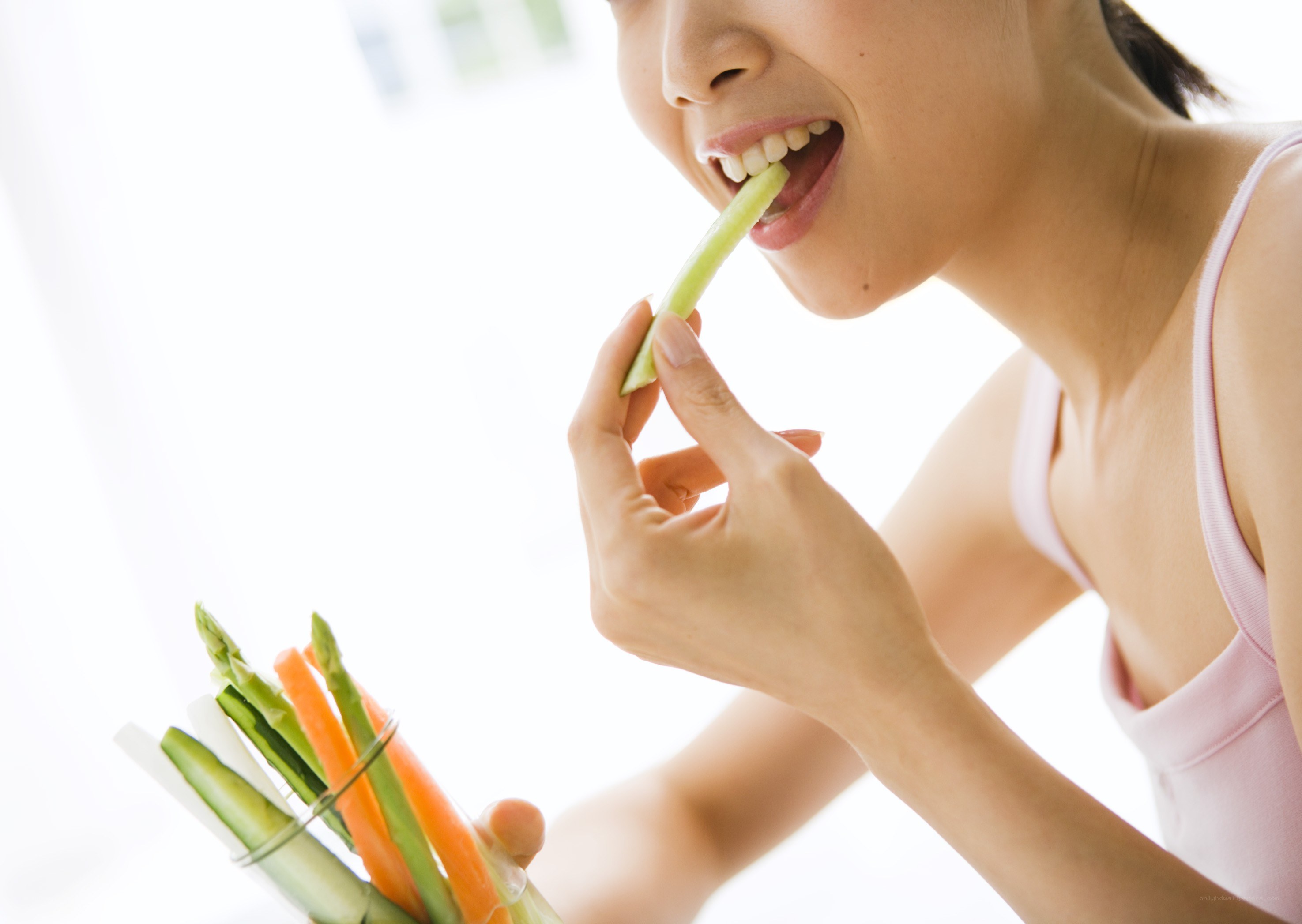 woman eating celery stick