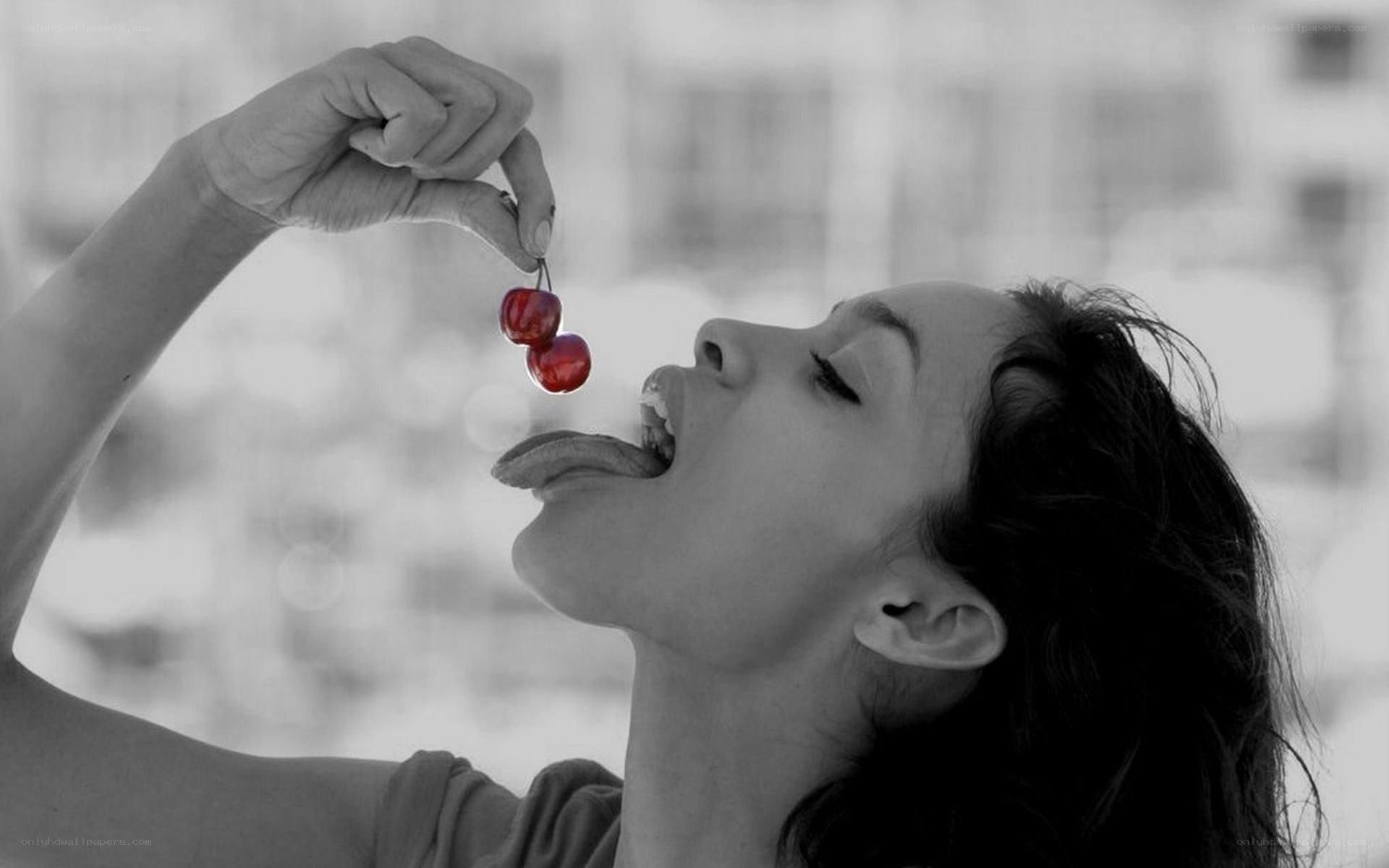 woman eating cherries