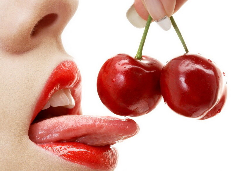 woman eating cherries