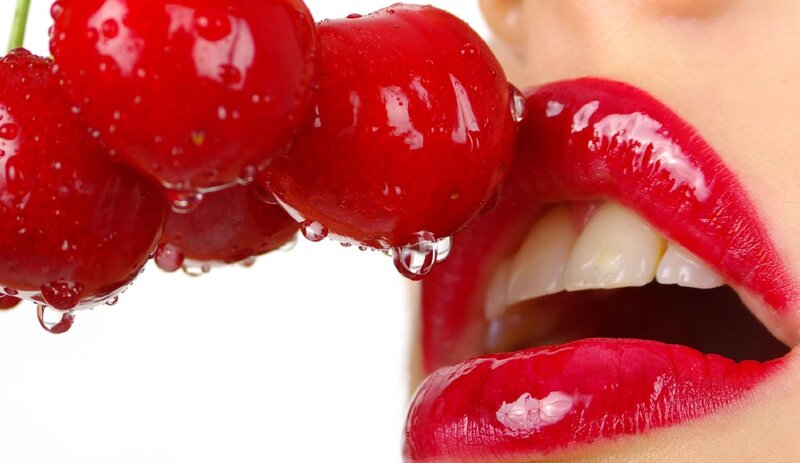 Woman Eating Cherries — Red