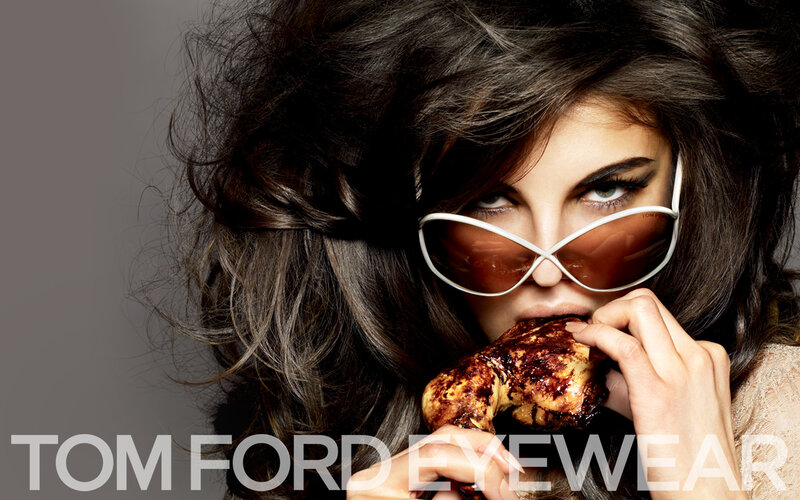 woman eating chicken with sunglasses