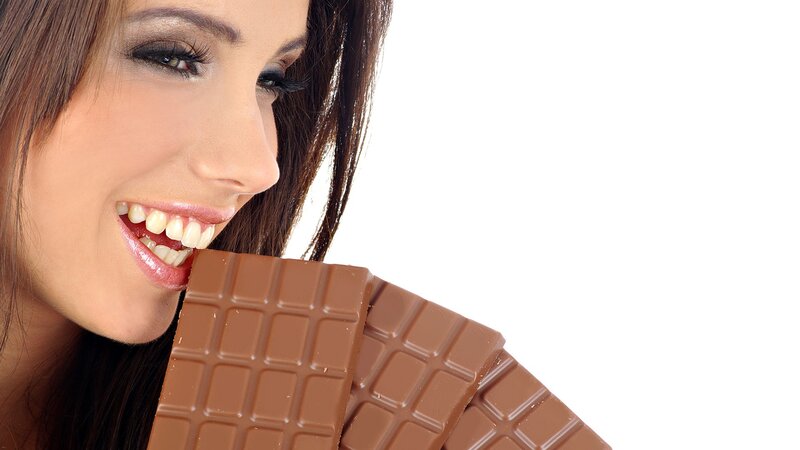 woman eating chocolate bar