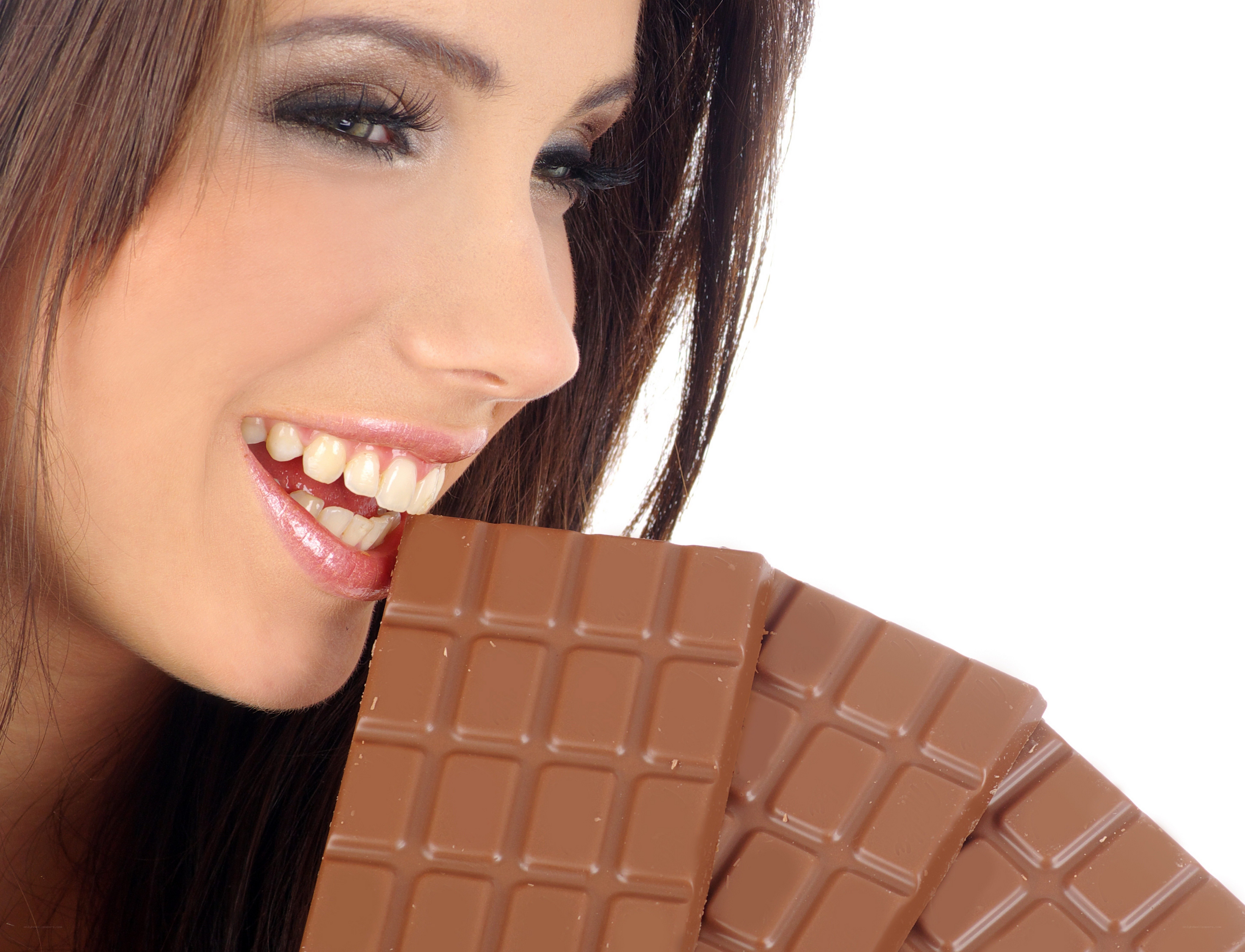 woman eating chocolate bar