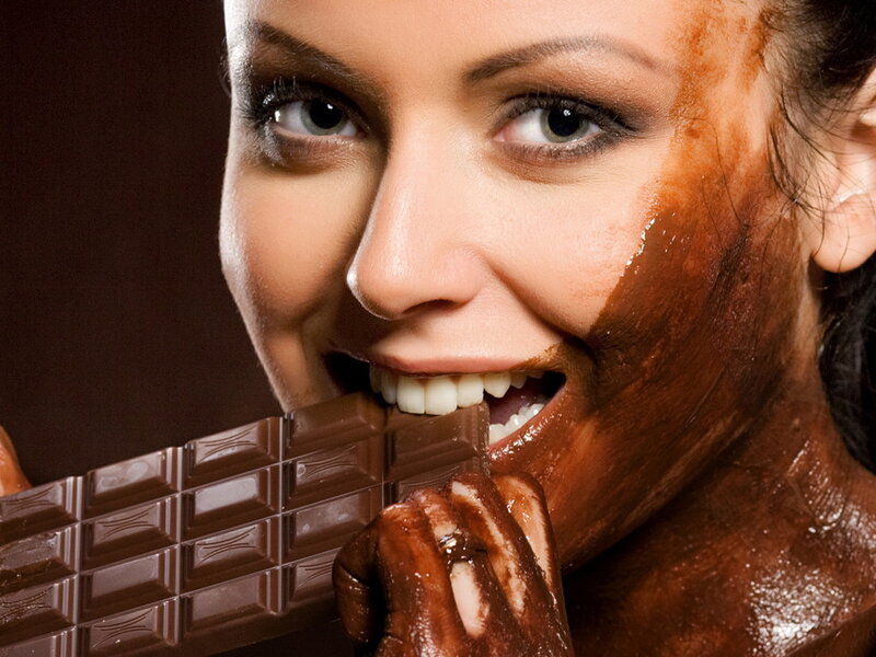 Woman Eating Chocolate — Brown