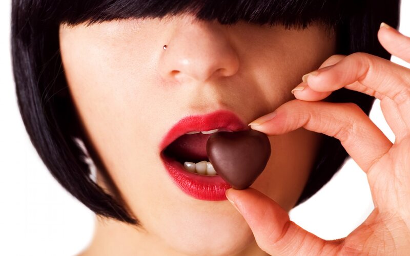 Woman Eating Chocolate — Red