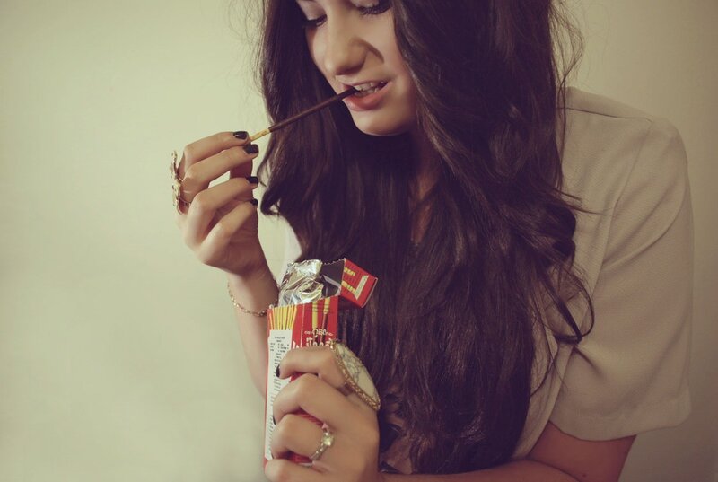 woman eating chocolate stick