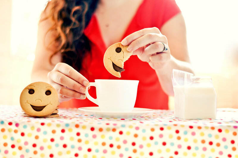 Woman Eating Cookie — Red