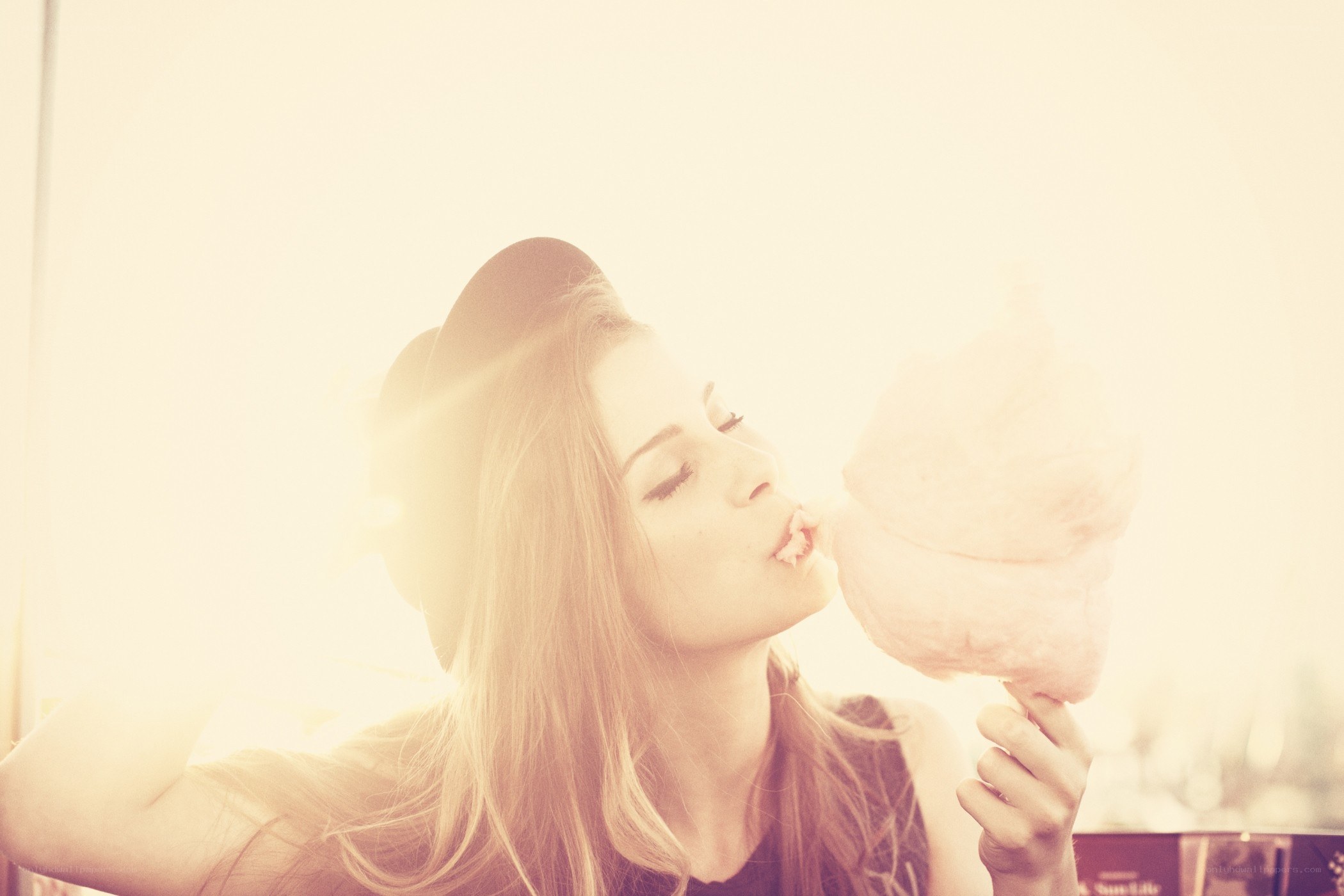 woman eating cotton candy