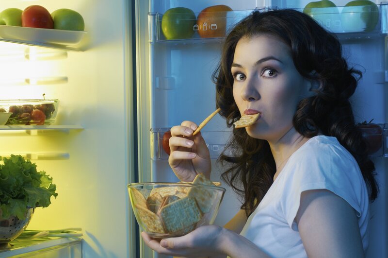 Woman Eating Crackers
