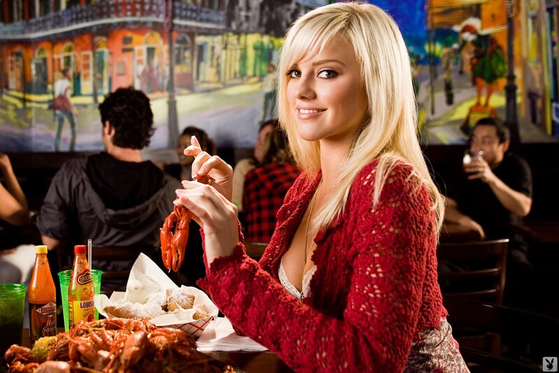 Woman eating crawfish at restaurant