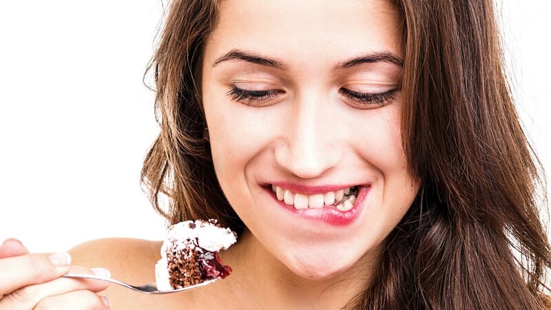 woman eating dessert