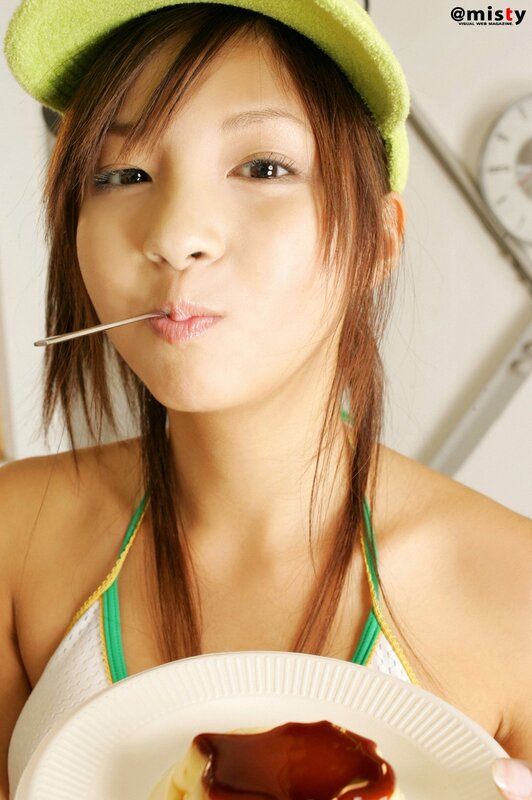 woman eating dessert with spoon