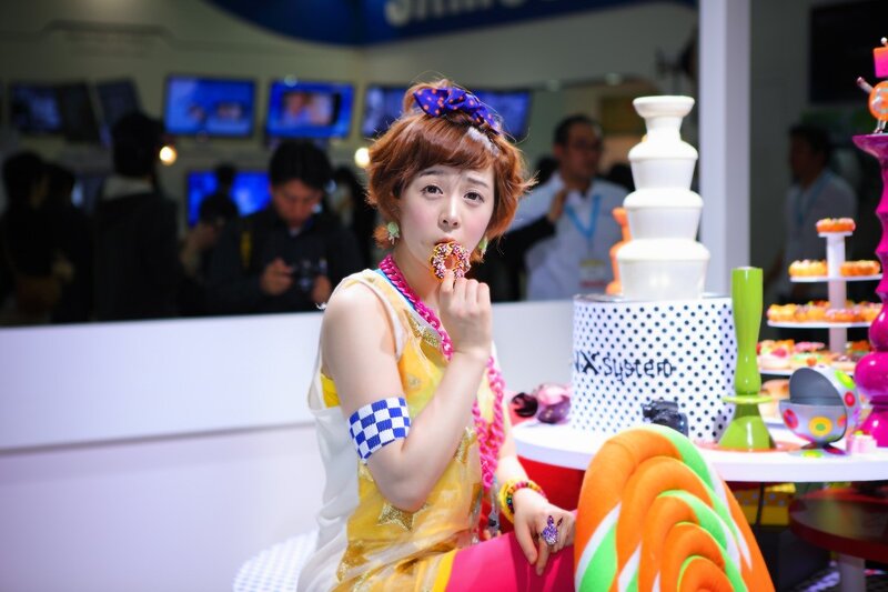 Woman eating donut at event