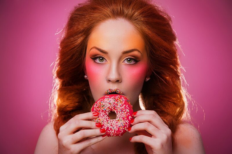 Woman Eating Donut — Pink