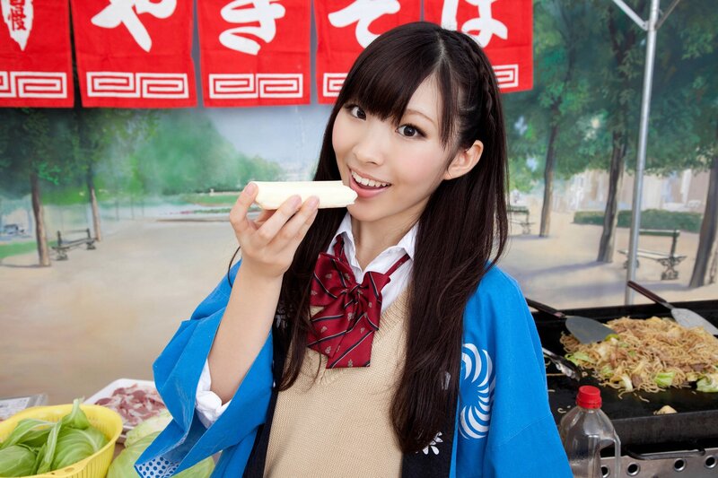 Woman eating food at festival