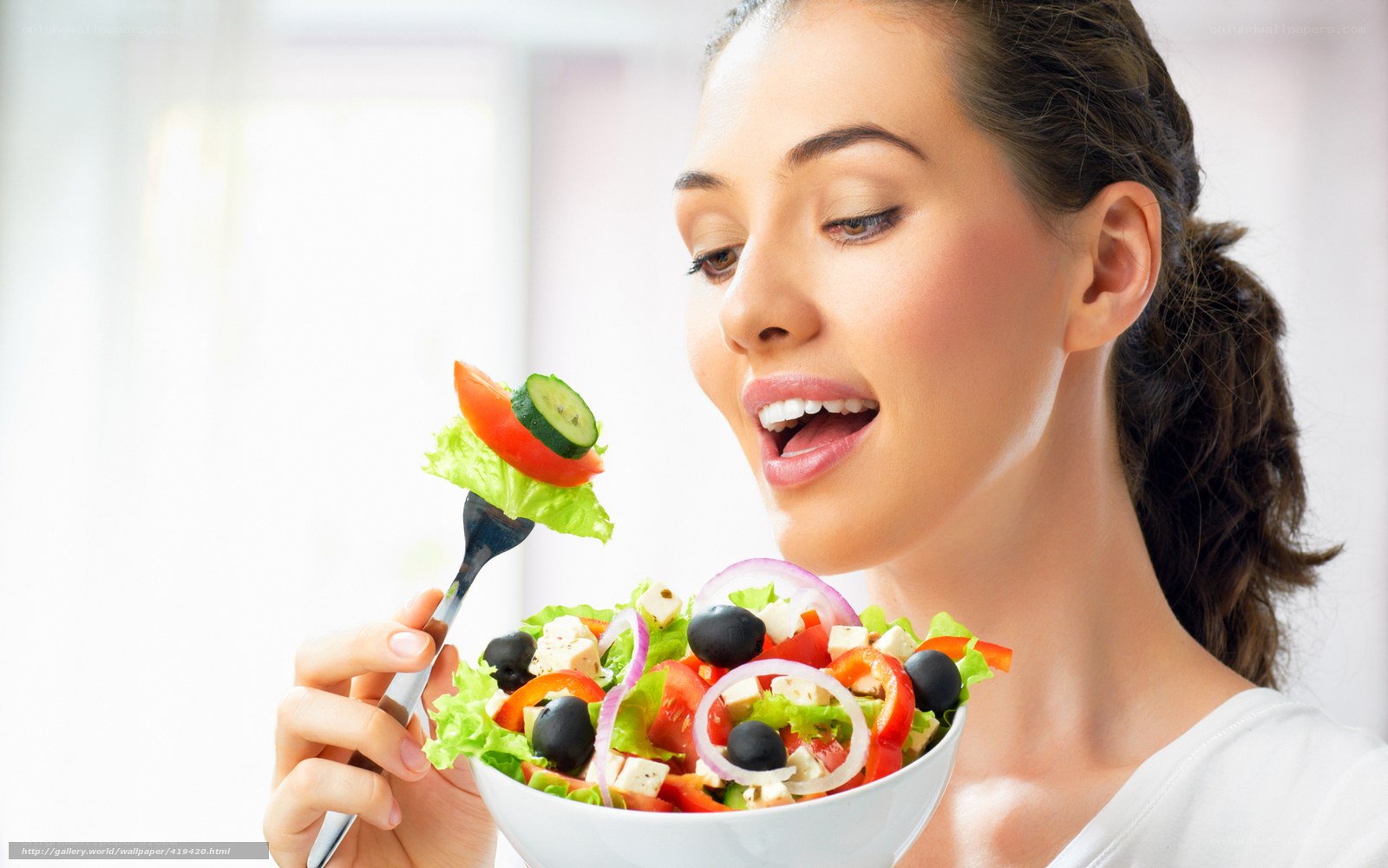 woman eating fresh salad