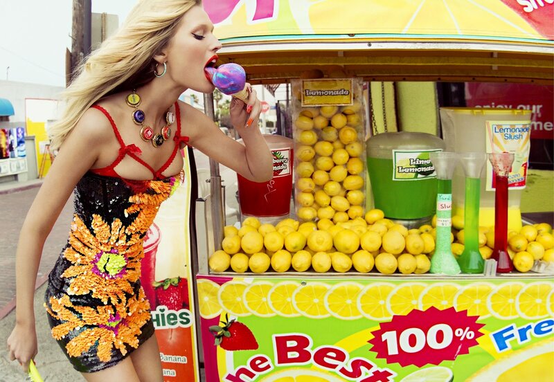 Woman eating ice cream at lemonade stand