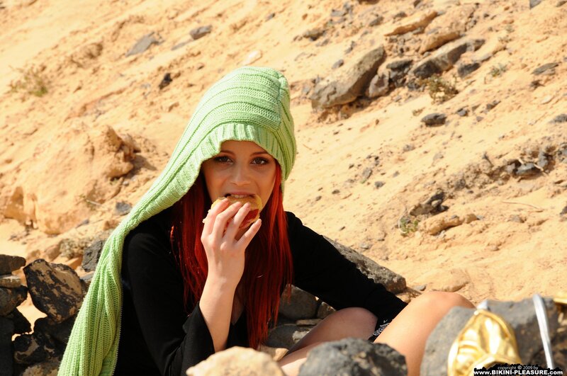 woman eating in desert