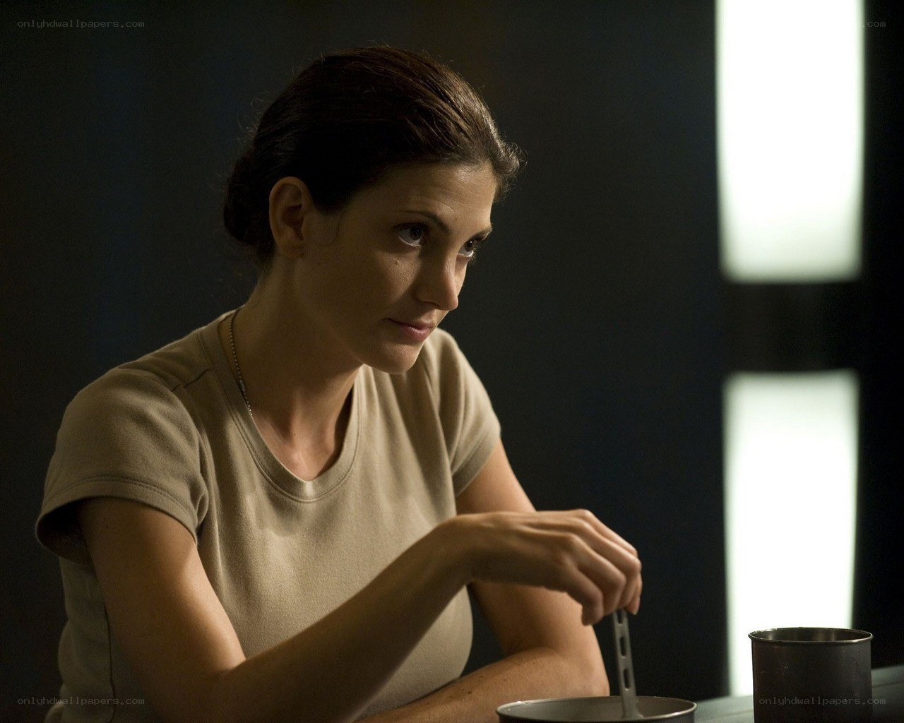 woman eating in dim light