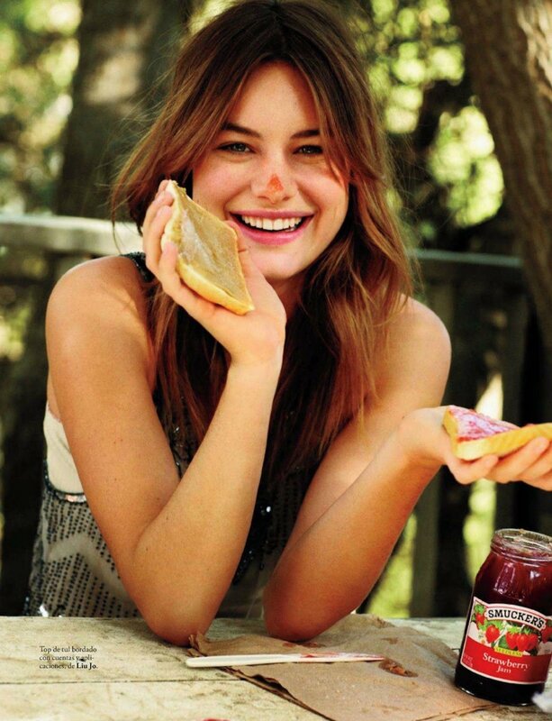 Woman eating jam sandwich