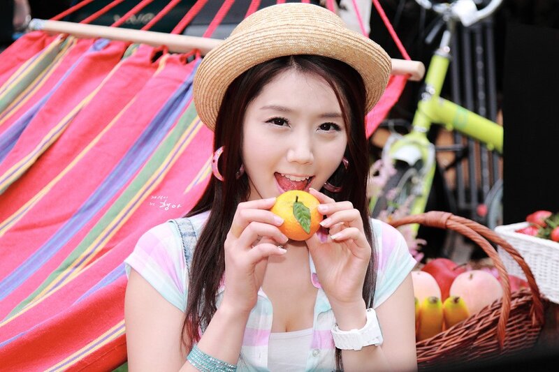 woman eating orange fruit
