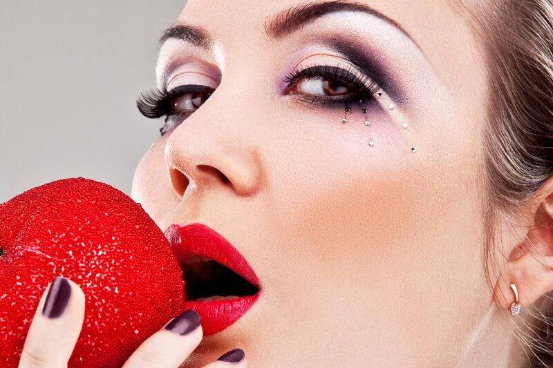 Woman Eating Red Apple — Dramatic, Photograph