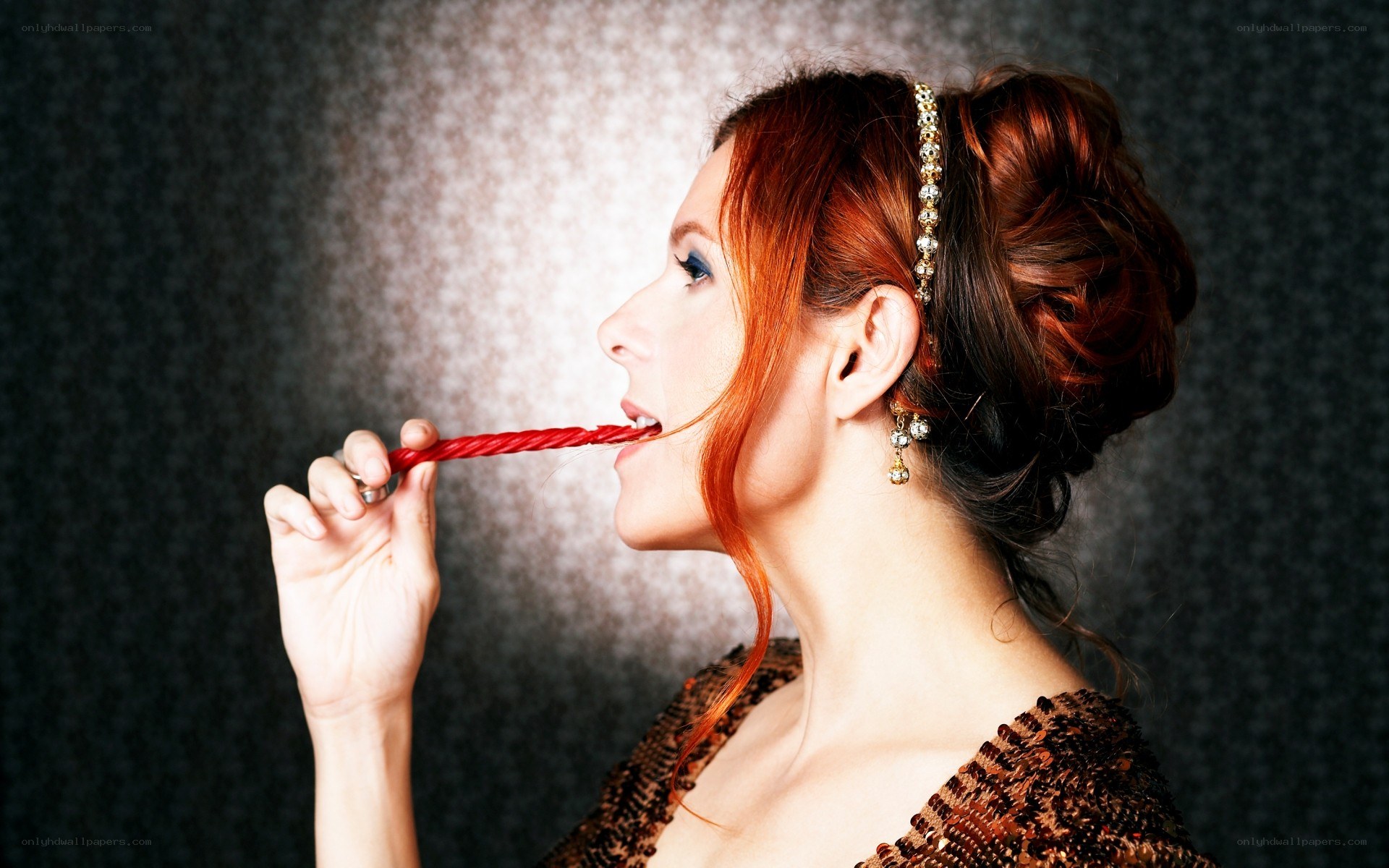 woman eating red candy