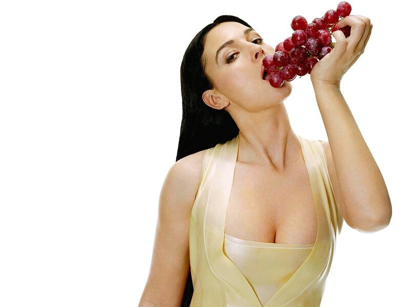 woman eating red grapes
