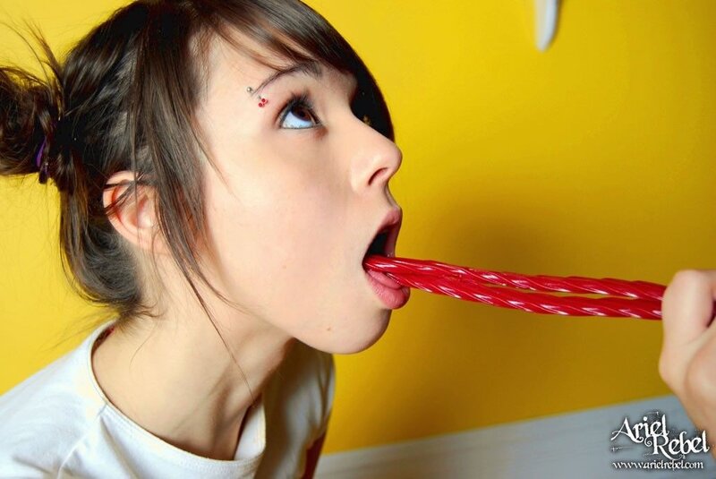 woman eating red licorice