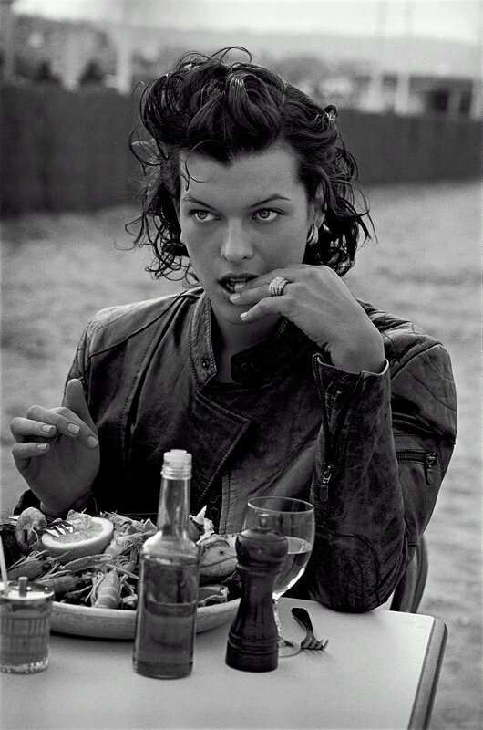 Woman eating seafood outdoors