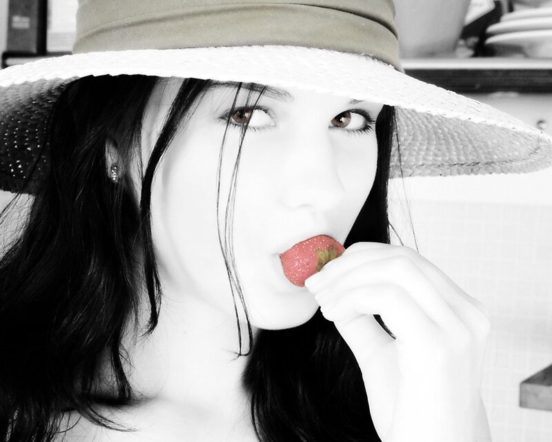 woman eating strawberry