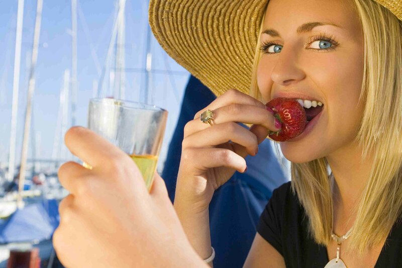 woman eating strawberry by marina