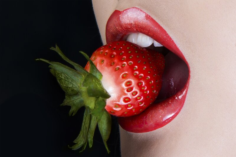 Woman Eating Strawberry — Red, Dramatic