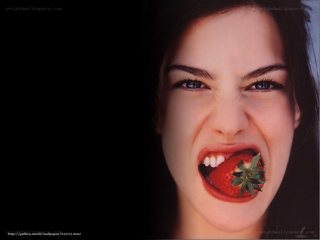 woman eating strawberry