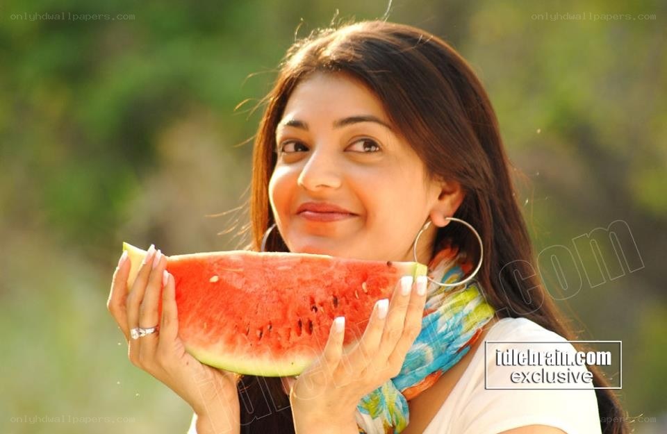woman eating watermelon slice