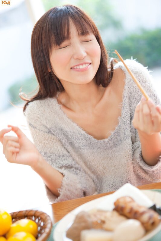 Woman eating with chopsticks