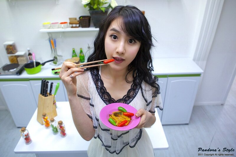 woman eating with chopsticks