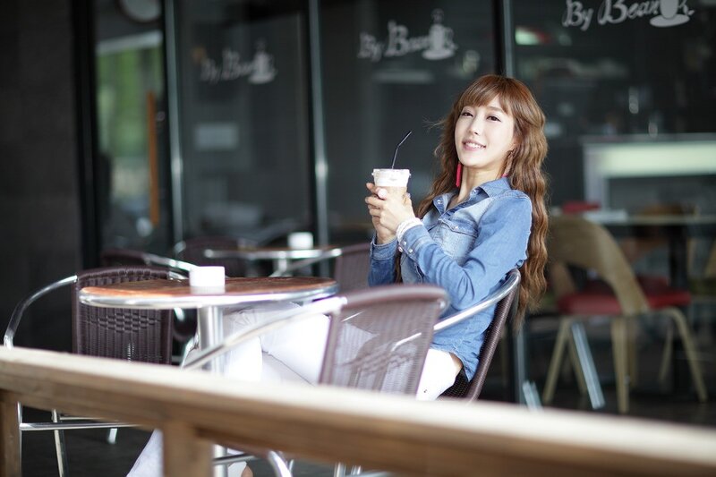 Woman enjoying coffee at cafe