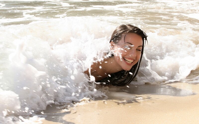 woman enjoying ocean waves