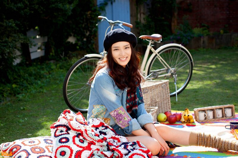 Woman enjoying picnic outdoors