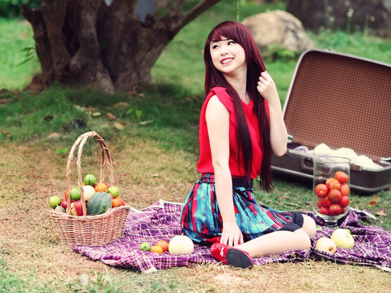 Woman enjoying picnic outdoors