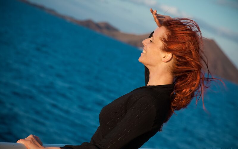 Woman enjoying sea breeze