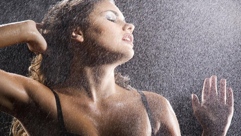 woman enjoying shower spray