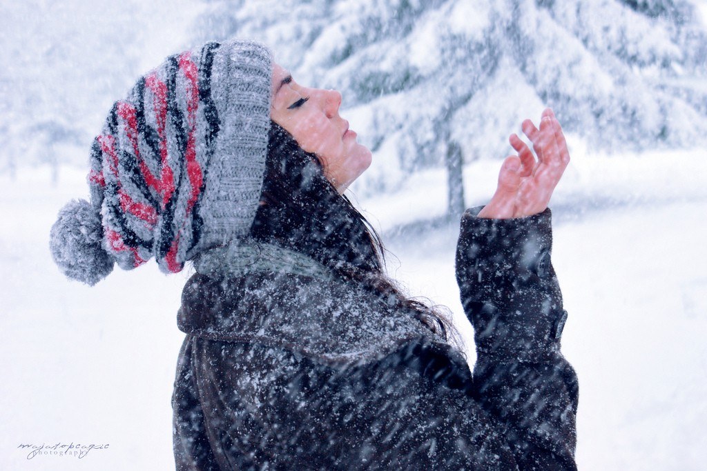 woman enjoying snowfall