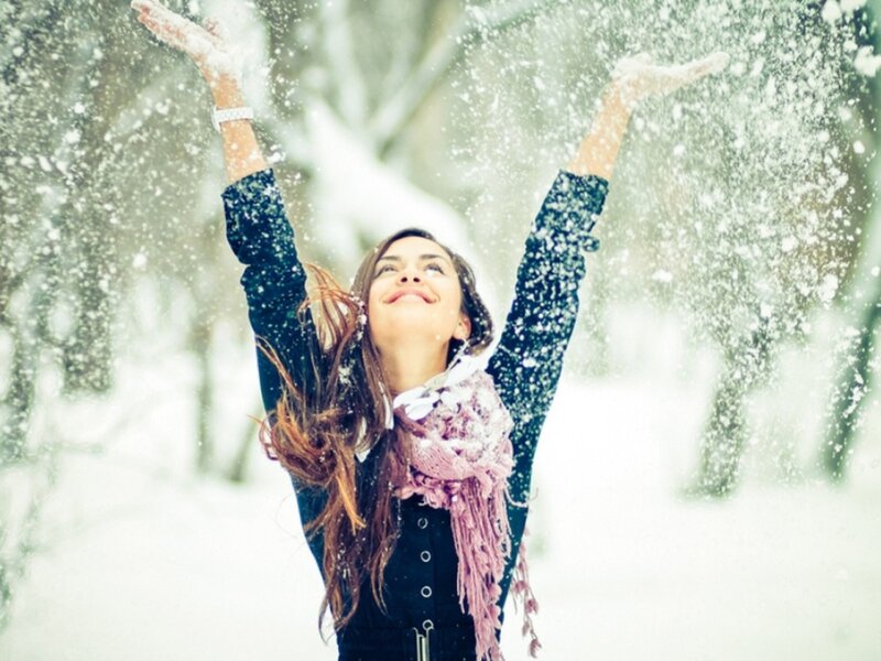 woman enjoying snowfall