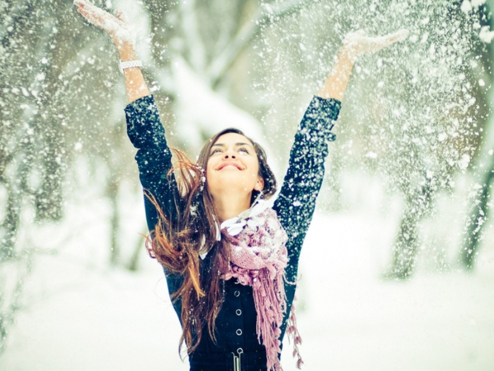 woman enjoying snowfall