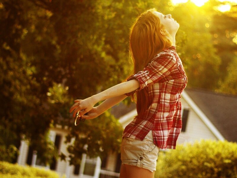 woman enjoying sunset outdoors