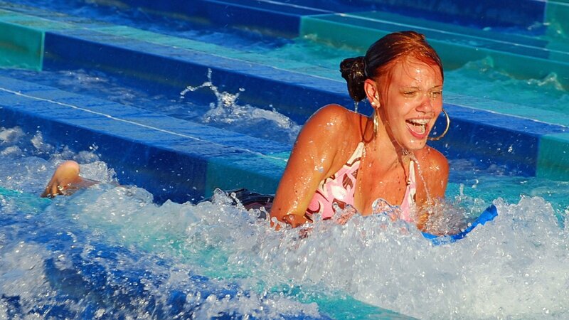 woman enjoying water park ride