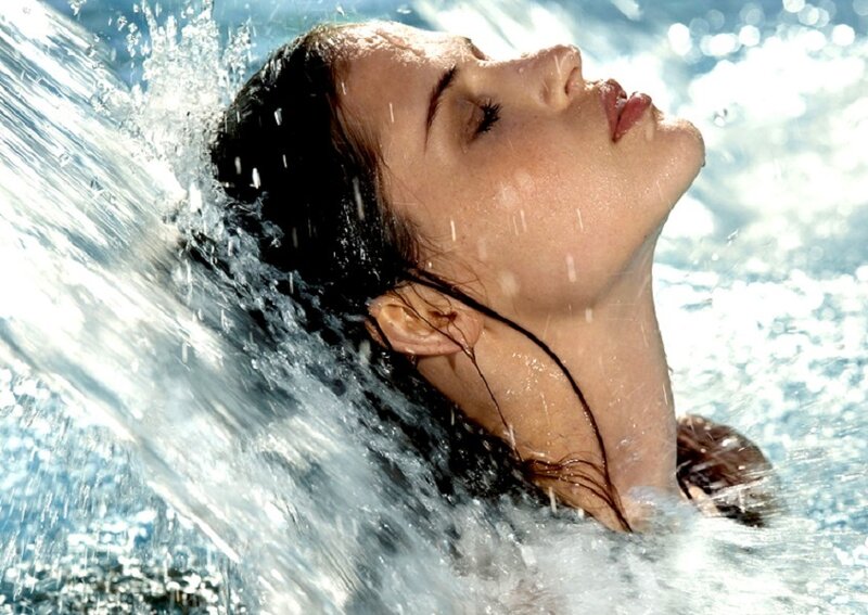 woman enjoying water spray